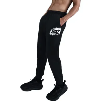 Dámská móda Pánské tepláky NIKE-M NK TF FLEECE JOGGER GFX BLACK Černá M
