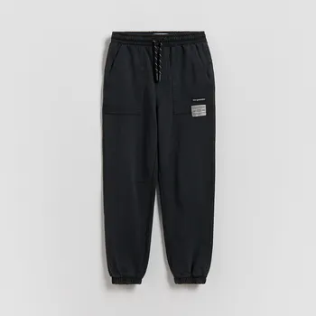 Dětská móda Reserved - Joggery se sepraným efektem - černý - 397HK-99X - 397HK-99X-134