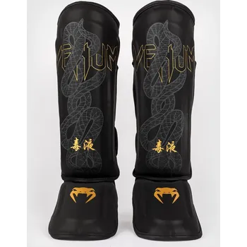 Chránič holeně pro bojový sport Venum Serpenti chrániče holení - černá/zlatá, VENUM-05757-109 L