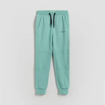 Dětská móda Reserved - Bavlněné kalhoty joggers - svěží zelená - 464HK-76X - 464HK-76X-140