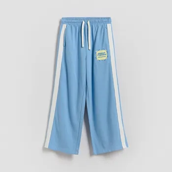 Dívčí oblečení Reserved - Teplákové kalhoty s lampasem - modrá - 127HN-55X - 127HN-55X-116