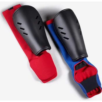 Chránič holeně pro bojový sport OUTSHOCK Dětský chránič holeně a nártu 900 s návlekem oboustranný (modrý nebo červený) XS MODRÁ|ČERNÁ|ČERVENÁ