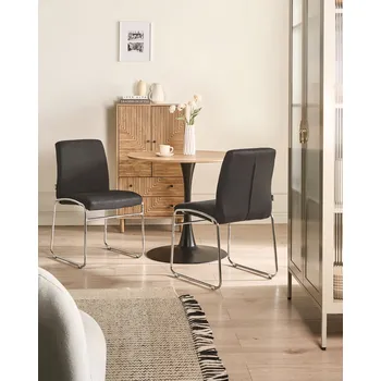 Jídelní židle Sada 2 jídelních židlí černé látkové čalounění bez područek kovová základna moderní design Beliani