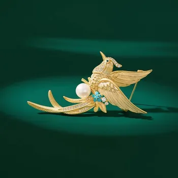 Brož Éternelle Luxusní brož v podobě bájného ptáka Fénixe B7334-XH2874 Zlatá