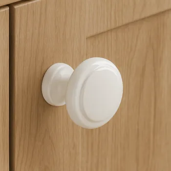 Nábytkové kování Interex Úchytka knopka SIMON / Bílá lesklá