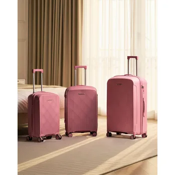 Sada 3 kufrů skořepinových růžový syntetický materiál železný zámek TSA tichá kolečka zip proti krádeži 3 velikosti moderní design Beliani