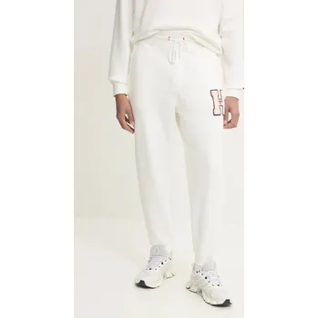 Bavlněné tepláky Tommy Jeans DM0DM21277 béžová 01X, vel. XXL