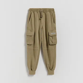 Dětská móda Reserved - Bavlněné kalhoty jogger - zelená - 402HK-87X - 402HK-87X-152