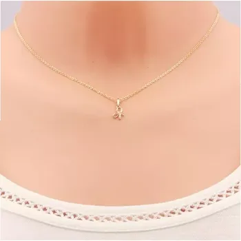 Přívěsek Přívěsek ze žlutého 14K zlata - lesklá uvázaná mašlička, linie čirých zirkonů