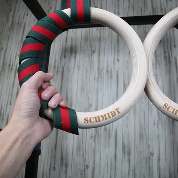 Závěsný posilovací systém IRONLIFE gymnastické kruhy SCHMIDT Gym Wood Ring - Set (dřevo), červený popruh