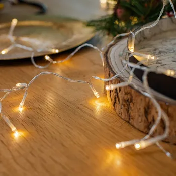 Lampička Lindby LED světelný řetěz Yven, 30 světel, 320 cm, časovač transparentní