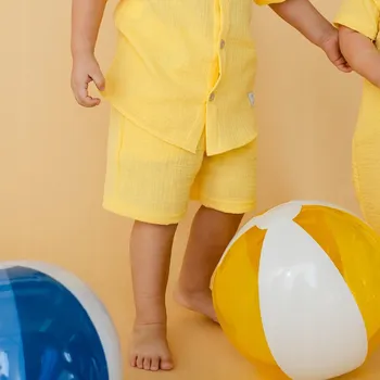 Chlapecké kraťasy Mušelínové dětské kraťasy žluté, velikost 74