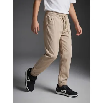 Dětská móda Sinsay - Bavlněné joggery - béžová - 079HE-80J - 079HE-80J-146