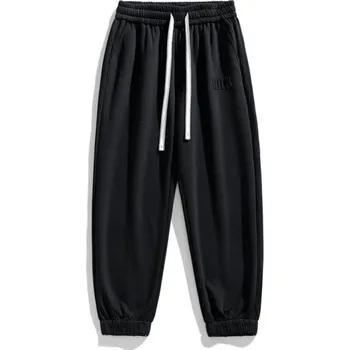 Pánské tepláky jednobarevné s kapsami na tkaničku, polyester, bavlna, pohodlný střih, ideální pro volný čas a sport černá S